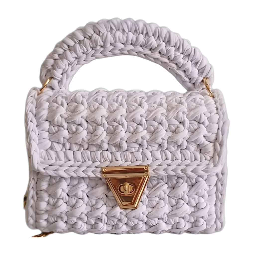 Pristine white crochet bag with gold hardware - Brunch at Tiffany’s quiet luxury collection