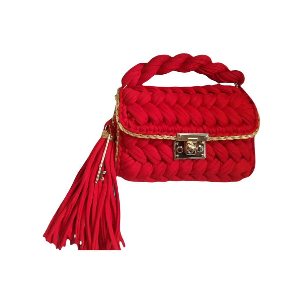 Cherry-red crochet handbag with gold shimmer edging and gold twist-lock clasp. Soft and structured texture with detachable gold chain.